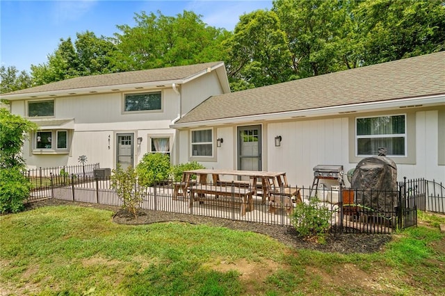 4815 Cheyenne Ln, Mclouth, KS 66054 - back of property with a patio area and roof with shingles