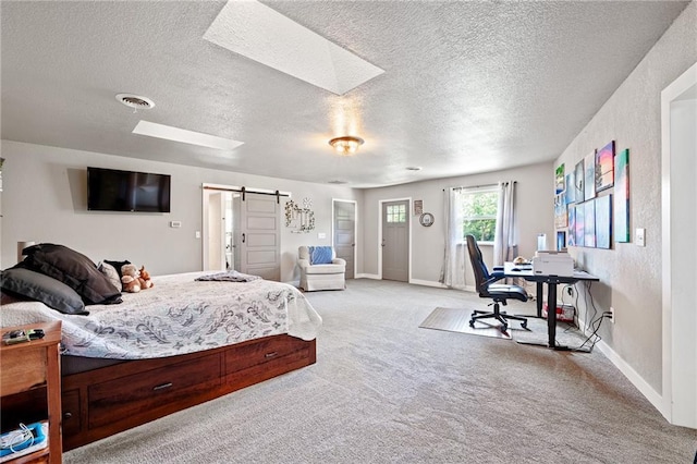 4815 Cheyenne Ln, Mclouth, KS 66054 - bedroom featuring a barn door, light colored carpet, a skylight, and a textured ceiling