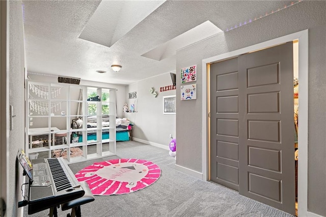 4815 Cheyenne Ln, Mclouth, KS 66054 - playroom featuring carpet floors, a textured ceiling, and french doors