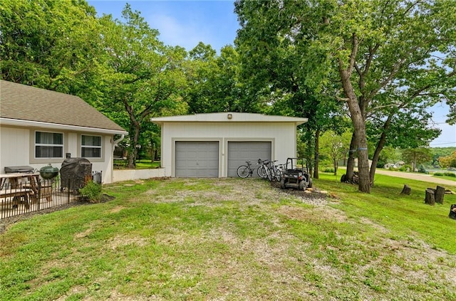 4815 Cheyenne Ln, Mclouth, KS 66054 - view of green lawn with an outbuilding and a garage