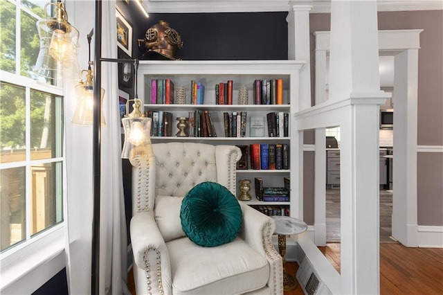 6000 Cherry St, Kansas City, MO 64110 - sitting room featuring ornate columns, wood finished floors, and ornamental molding