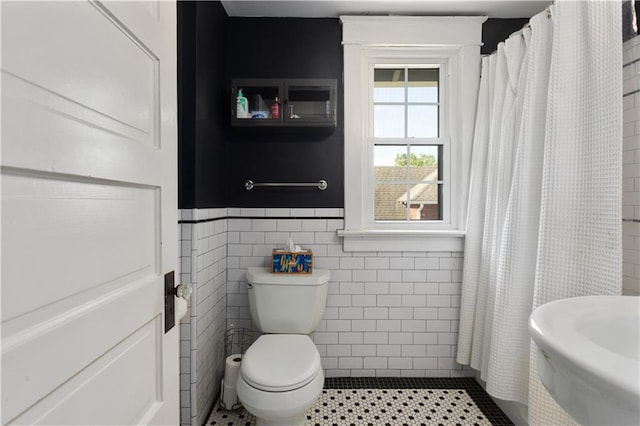 6000 Cherry St, Kansas City, MO 64110 - full bathroom featuring tile walls, a shower with curtain, and tile patterned flooring