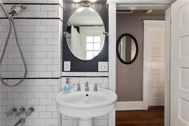 6000 Cherry St, Kansas City, MO 64110 - bathroom with wood finished floors and a sink