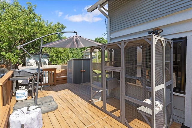6000 Cherry St, Kansas City, MO 64110 - wooden deck with a shed