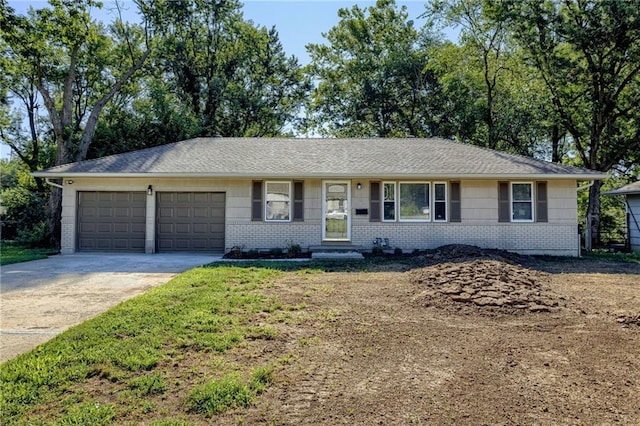 10201 Hillcrest Rd, Kansas City, MO 64134 - ranch-style home featuring driveway, brick siding, and an attached garage