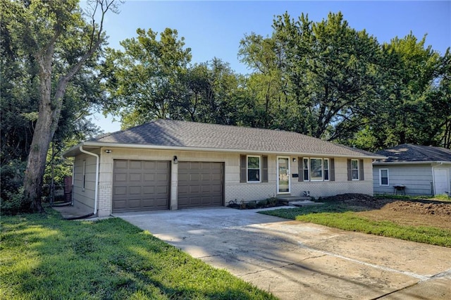 10201 Hillcrest Rd, Kansas City, MO 64134 - ranch-style home with driveway, an attached garage, a front yard, and brick siding