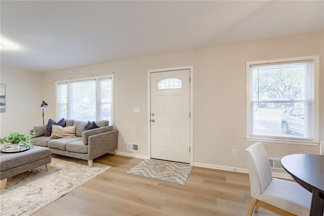 10201 Hillcrest Rd, Kansas City, MO 64134 - entryway featuring healthy amount of natural light and light wood-style flooring