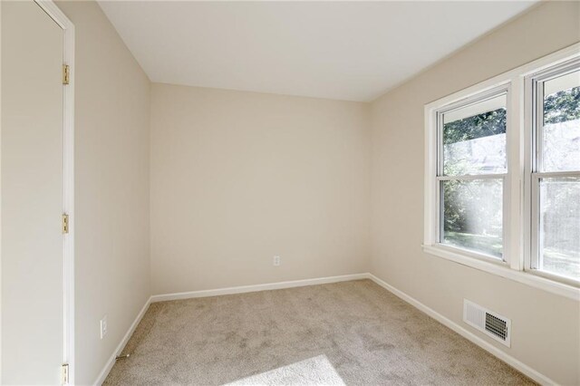 10201 Hillcrest Rd, Kansas City, MO 64134 - carpeted empty room featuring baseboards