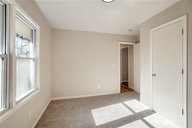 10201 Hillcrest Rd, Kansas City, MO 64134 - unfurnished bedroom with carpet floors and multiple windows