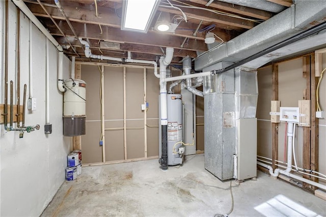 10201 Hillcrest Rd, Kansas City, MO 64134 - unfinished below grade area featuring gas water heater and heating unit