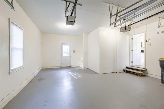 10201 Hillcrest Rd, Kansas City, MO 64134 - garage featuring a garage door opener