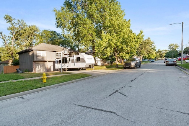 820 S Virginia Ln, Olathe, KS 66061 - view of asphalt street featuring street lighting, sidewalks, and curbs