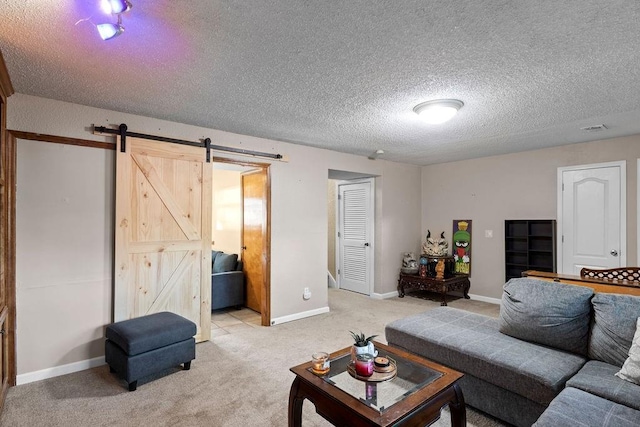 820 S Virginia Ln, Olathe, KS 66061 - living area featuring a barn door, light carpet, and a textured ceiling