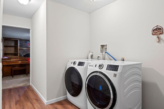 820 S Virginia Ln, Olathe, KS 66061 - washroom featuring washer and clothes dryer and wood finished floors