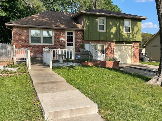7609 Hayes St, Overland Park, KS 66204 - tri-level home with brick siding, an attached garage, board and batten siding, driveway, and roof with shingles