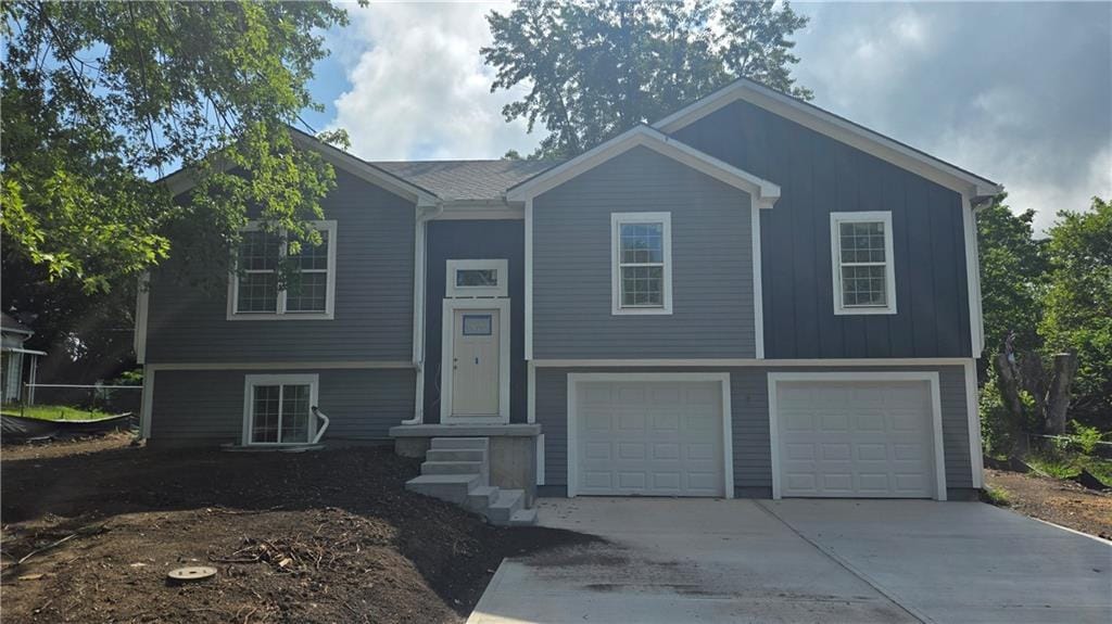 805 Thieme St, Grain Valley, MO 64029 - bi-level home featuring driveway and an attached garage