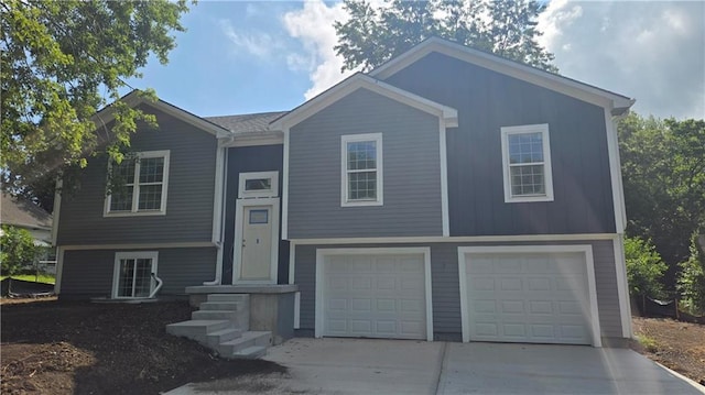 805 Thieme St, Grain Valley, MO 64029 - raised ranch featuring concrete driveway and an attached garage