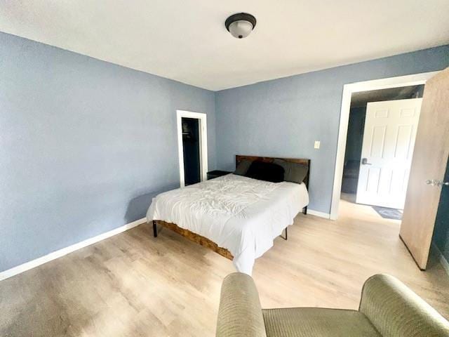 522 S 11th St, Independence, KS 67301 - bedroom with light wood finished floors and baseboards