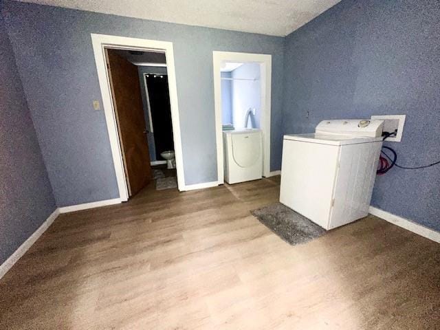 522 S 11th St, Independence, KS 67301 - laundry area with washer / clothes dryer and wood finished floors