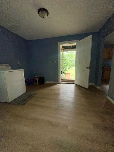 522 S 11th St, Independence, KS 67301 - unfurnished room with washer / dryer and a textured ceiling