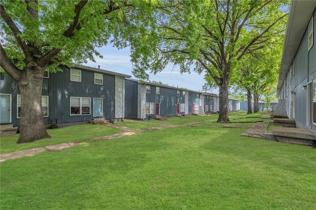 2410 38th St, Kansas City, KS 66104 - view of green lawn featuring entry steps