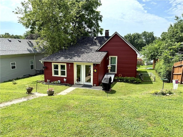 715 Harmon St, Saint Joseph, MO 64504 - back of house featuring a chimney and a shingled roof