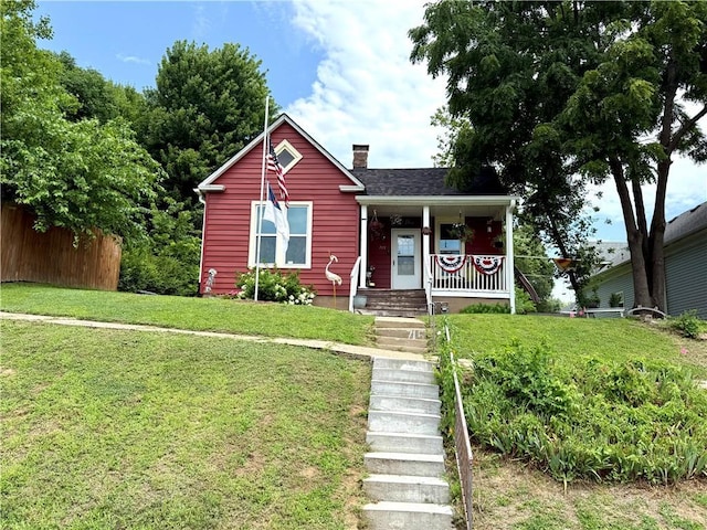 715 Harmon St, Saint Joseph, MO 64504 - bungalow featuring covered porch and a chimney
