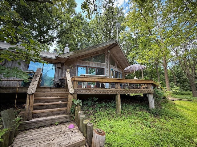 24604 E 327th St, Harrisonville, MO 64701 - back of property featuring a wooden deck, a chimney, and stairway