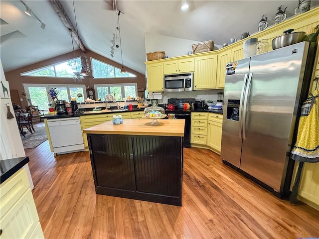 24604 E 327th St, Harrisonville, MO 64701 - kitchen featuring stainless steel appliances, rail lighting, wooden counters, and light wood-style flooring