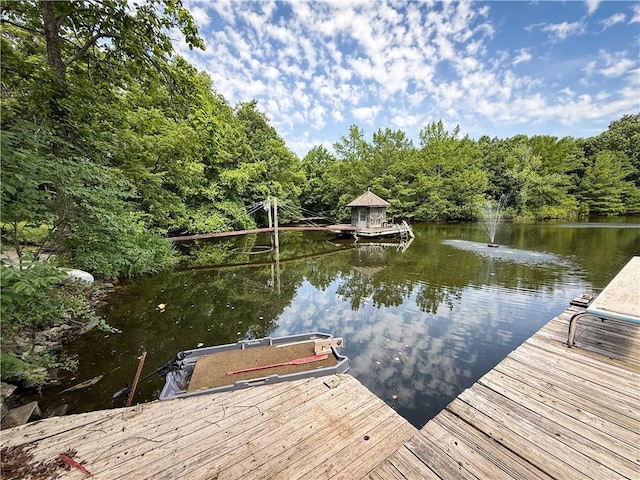 24604 E 327th St, Harrisonville, MO 64701 - dock area featuring a water view and a wooded view