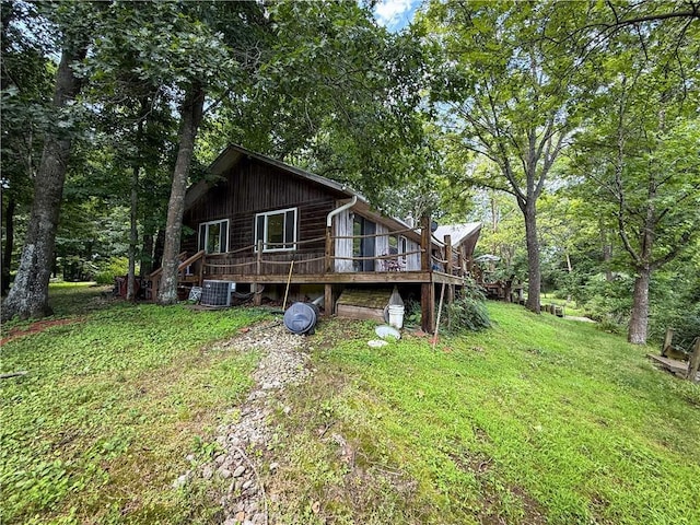 24604 E 327th St, Harrisonville, MO 64701 - back of property featuring a wooden deck and a lawn