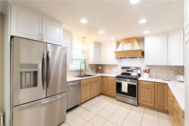 12408 Monroe Ave, Grandview, MO 64030 - kitchen with appliances with stainless steel finishes, premium range hood, light countertops, backsplash, and a textured ceiling