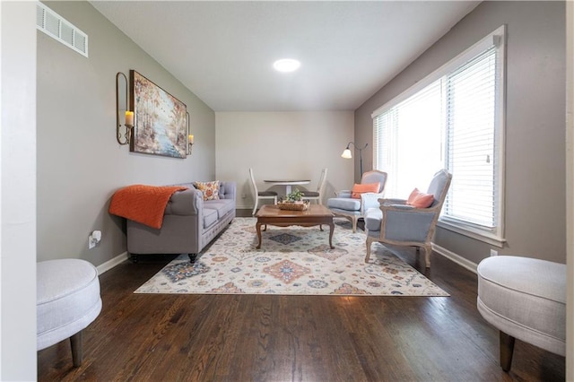 12408 Monroe Ave, Grandview, MO 64030 - living area with dark wood-style floors