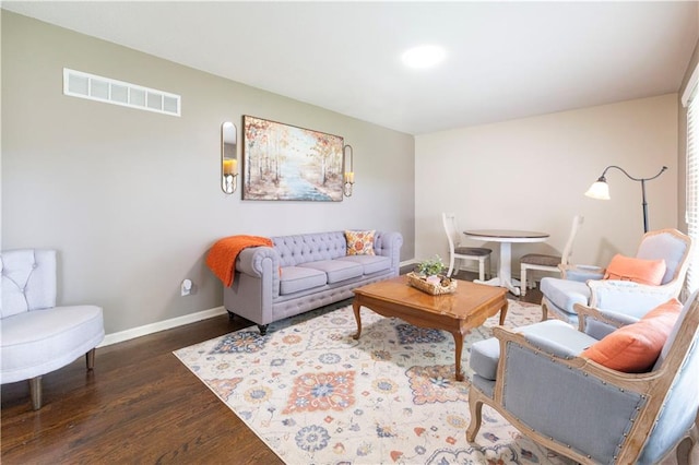 12408 Monroe Ave, Grandview, MO 64030 - living area featuring wood finished floors and baseboards