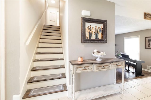 12408 Monroe Ave, Grandview, MO 64030 - stairs featuring tile patterned flooring