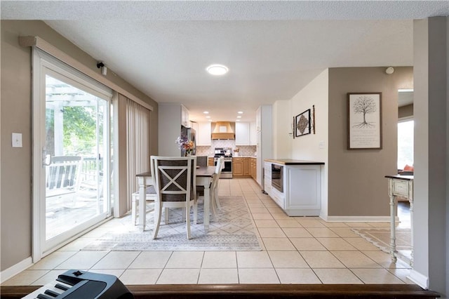 12408 Monroe Ave, Grandview, MO 64030 - dining space featuring light tile patterned floors and recessed lighting
