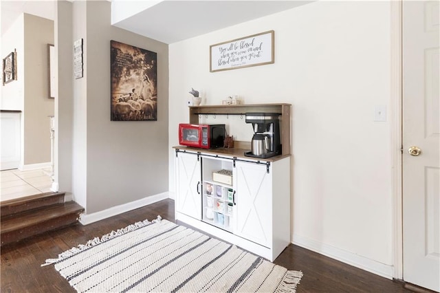 12408 Monroe Ave, Grandview, MO 64030 - detailed view of wood finished floors and baseboards