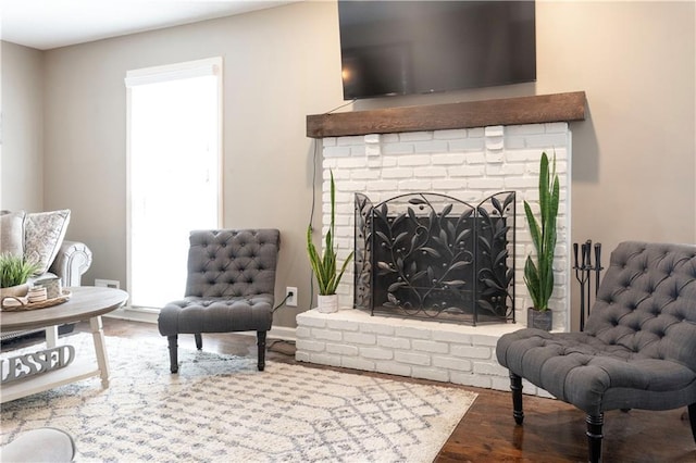 12408 Monroe Ave, Grandview, MO 64030 - living area featuring a fireplace and wood finished floors