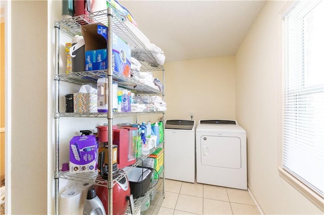 12408 Monroe Ave, Grandview, MO 64030 - laundry room featuring washer and dryer and tile patterned floors