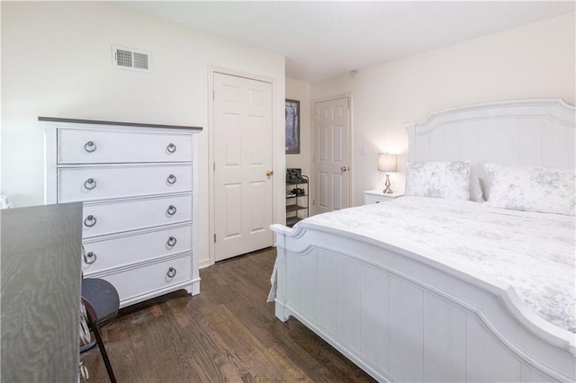12408 Monroe Ave, Grandview, MO 64030 - bedroom with dark wood-style flooring