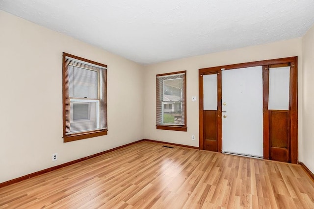 2527 N 18th St, Kansas City, KS 66104 - entryway with light wood-style flooring and baseboards