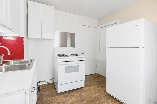 2527 N 18th St, Kansas City, KS 66104 - kitchen featuring white appliances, white cabinetry, wood finished floors, and light countertops