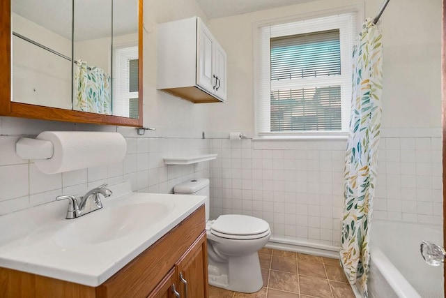 2527 N 18th St, Kansas City, KS 66104 - full bath with tile walls, vanity, shower / bath combo with shower curtain, tile patterned flooring, and wainscoting