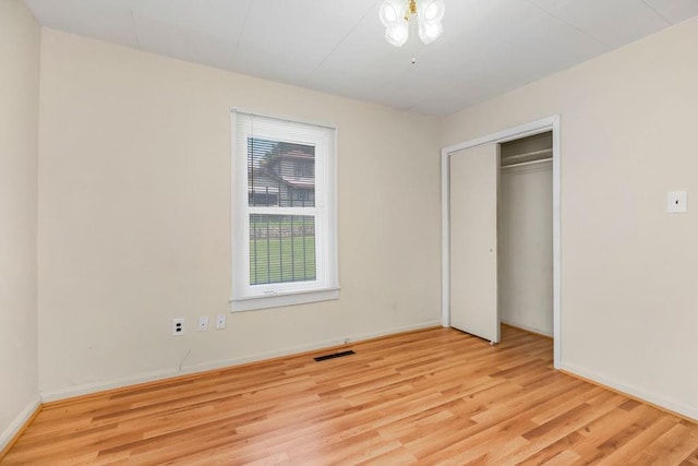 2527 N 18th St, Kansas City, KS 66104 - unfurnished bedroom with wood finished floors and a closet