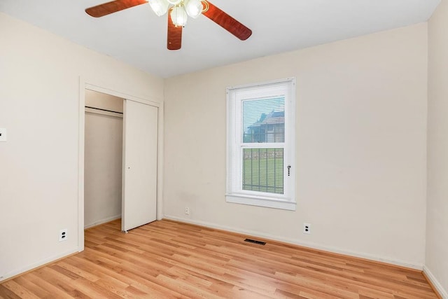 2527 N 18th St, Kansas City, KS 66104 - unfurnished bedroom with light wood-style floors, a closet, and a ceiling fan