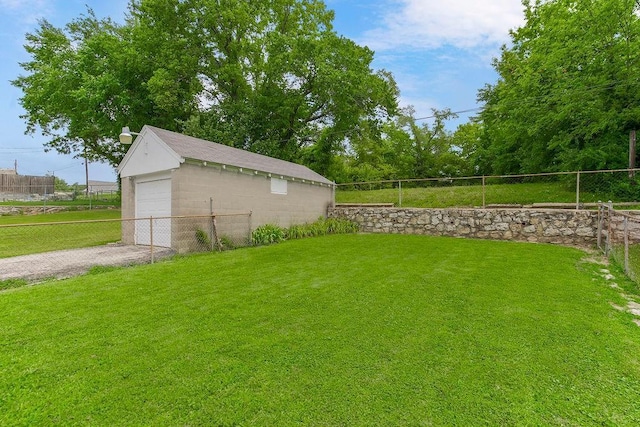 2527 N 18th St, Kansas City, KS 66104 - view of yard featuring a garage and driveway