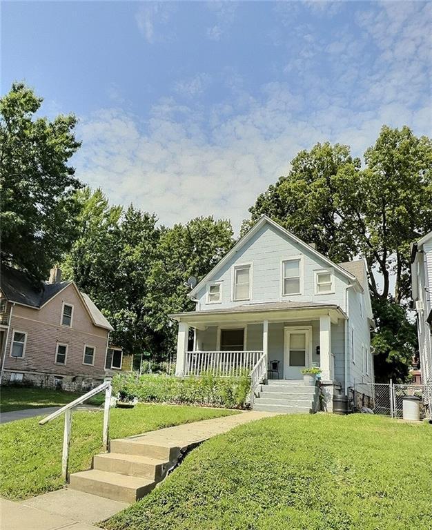 2006 Agnes Ave, Kansas City, MO 64127 - view of front of house featuring covered porch