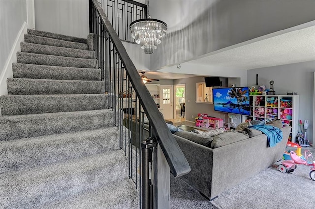 5300 NW 58th Ter, Kansas City, MO 64151 - staircase with carpet flooring and a chandelier