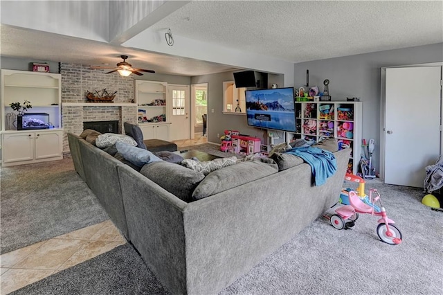 5300 NW 58th Ter, Kansas City, MO 64151 - carpeted living room featuring ceiling fan, a textured ceiling, and a brick fireplace