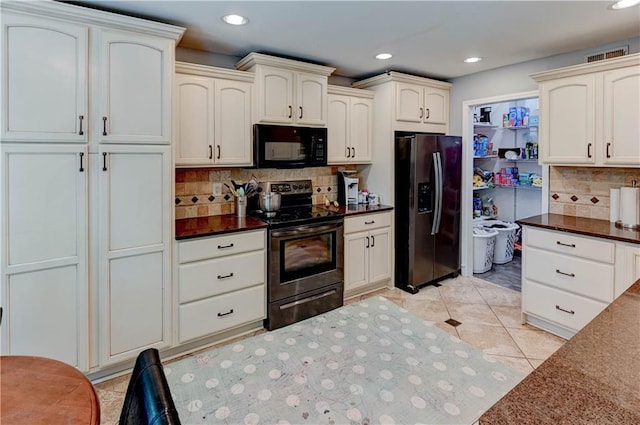 5300 NW 58th Ter, Kansas City, MO 64151 - kitchen with black microwave, stainless steel range with electric cooktop, refrigerator with ice dispenser, recessed lighting, and backsplash